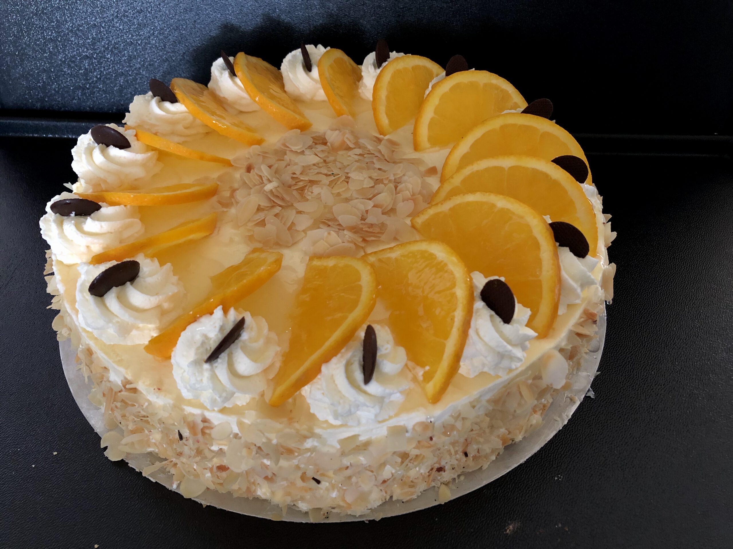 Orangen-Sahne-Torte, Portionsstück - Stadtbäckerei Strate in Lemgo